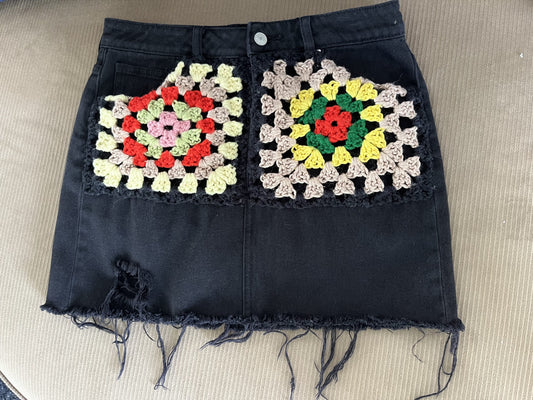 A black skirt with multicolored squares on it.