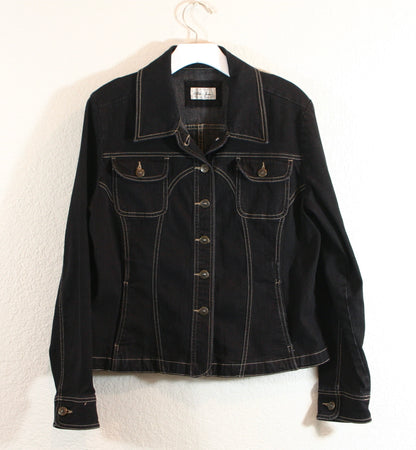 A black jacket on a white wall.