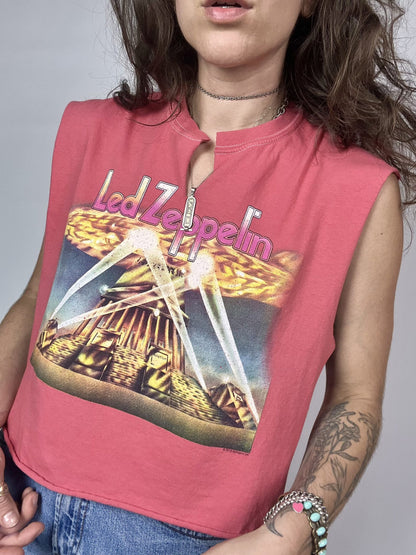 a woman wearing a pink shirt with a picture on it.