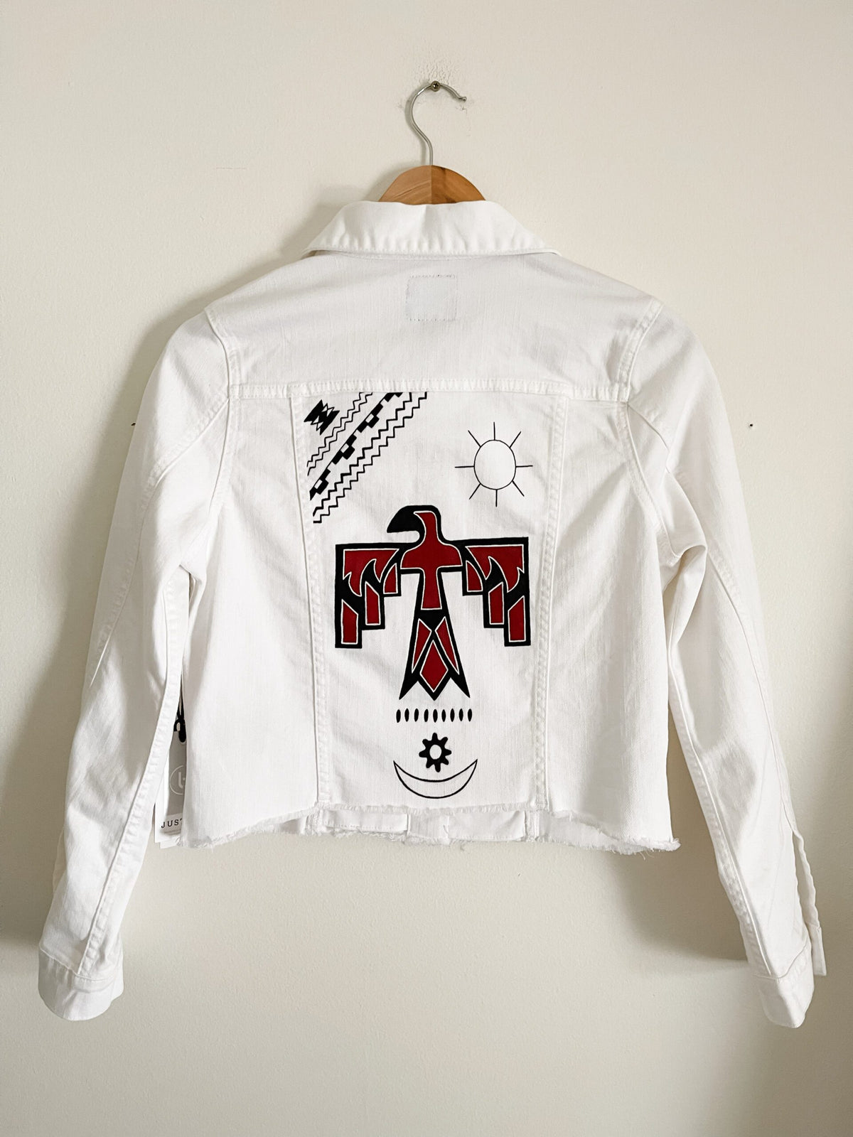 A white jacket with an eagle on it.