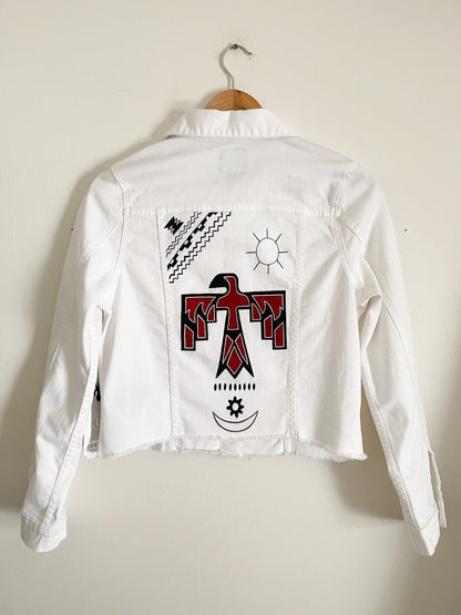 A white jacket with an eagle on it.