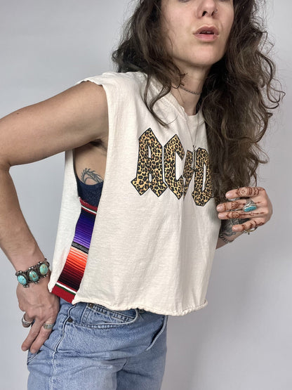 a woman with long hair wearing a tank top.
