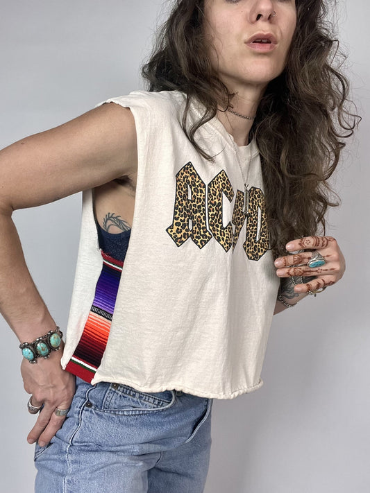 a woman with long hair wearing a tank top.
