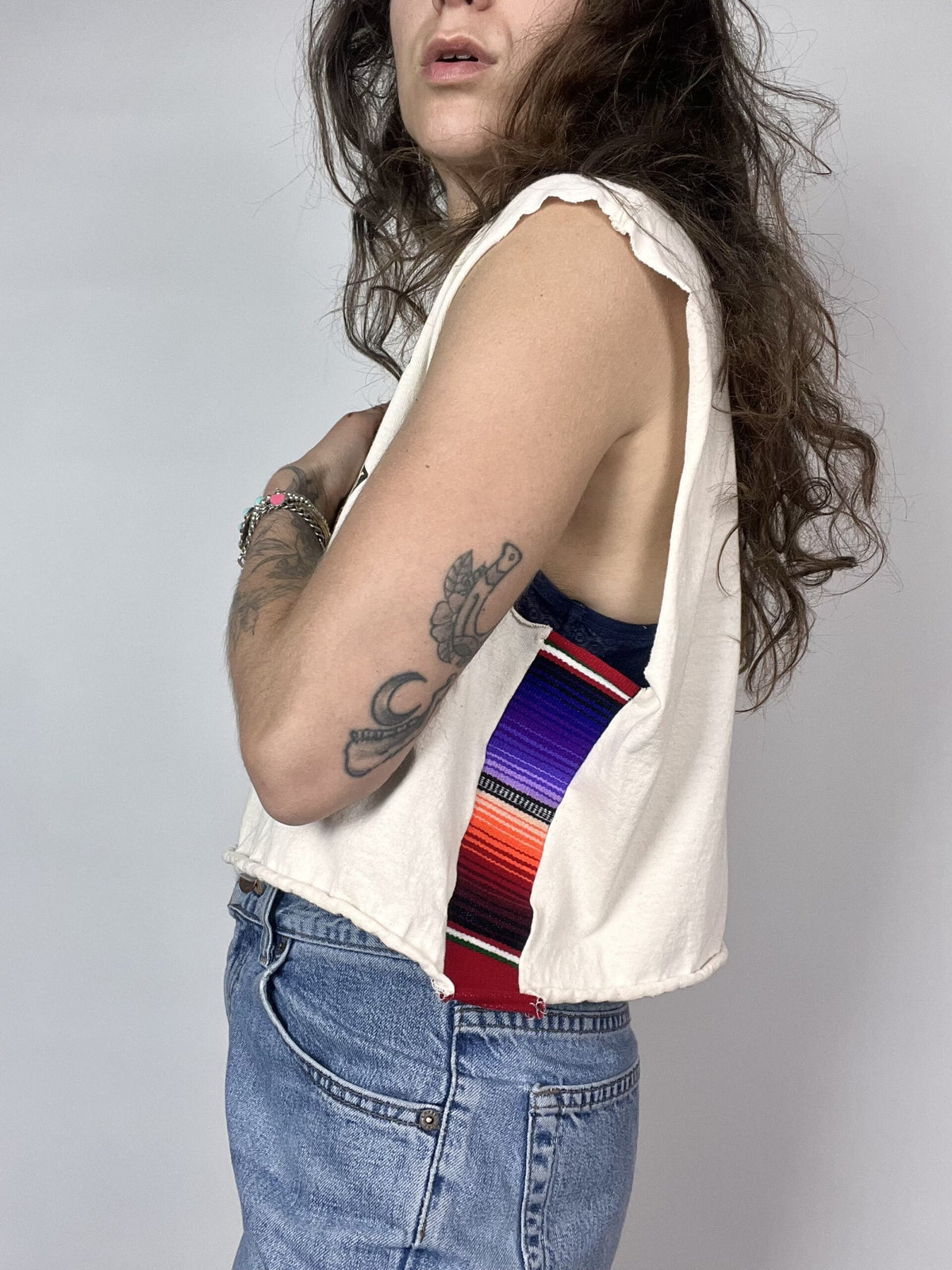 a woman with long hair wearing a tie.