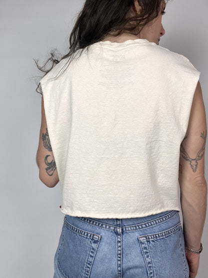 a woman wearing a white shirt and jeans.