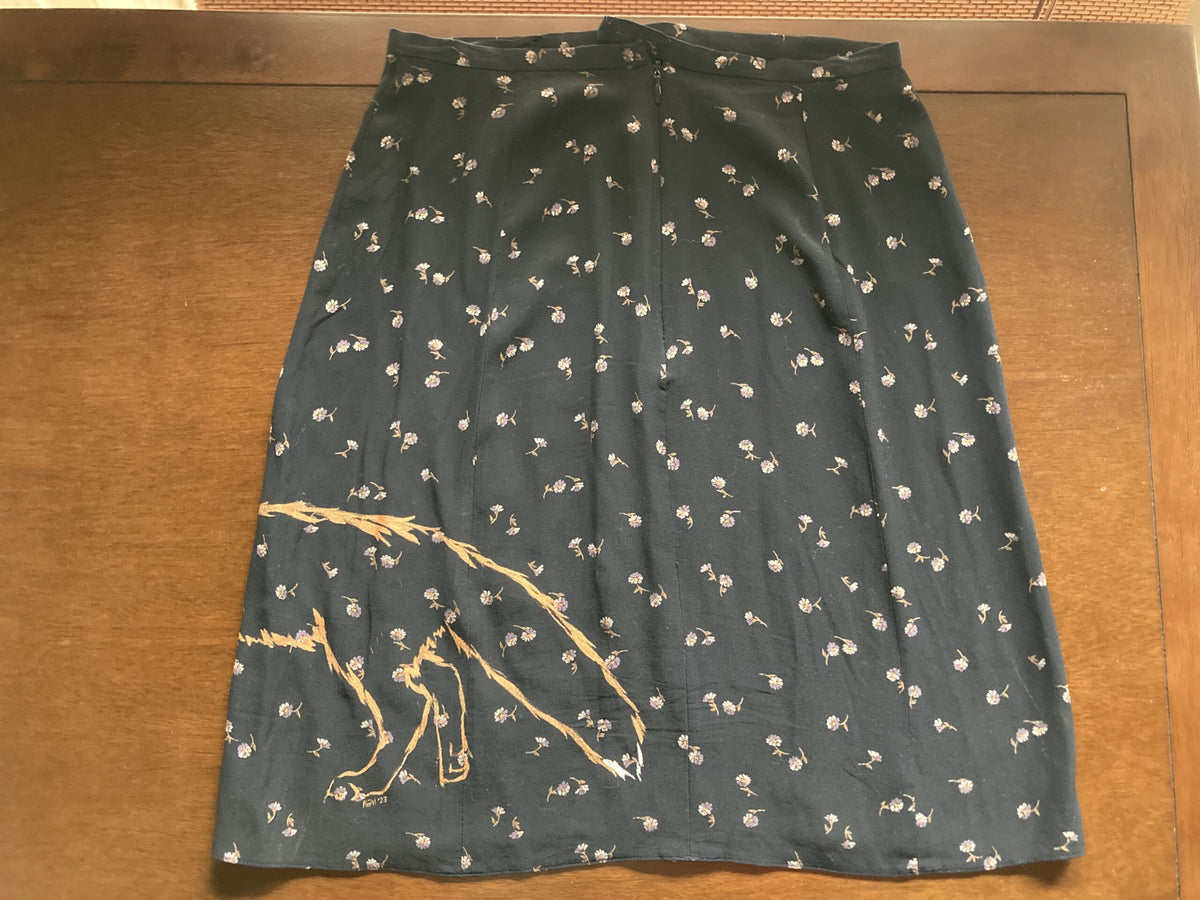 A Floral fox hand-painted vintage skirt with a picture of a person holding an umbrella.