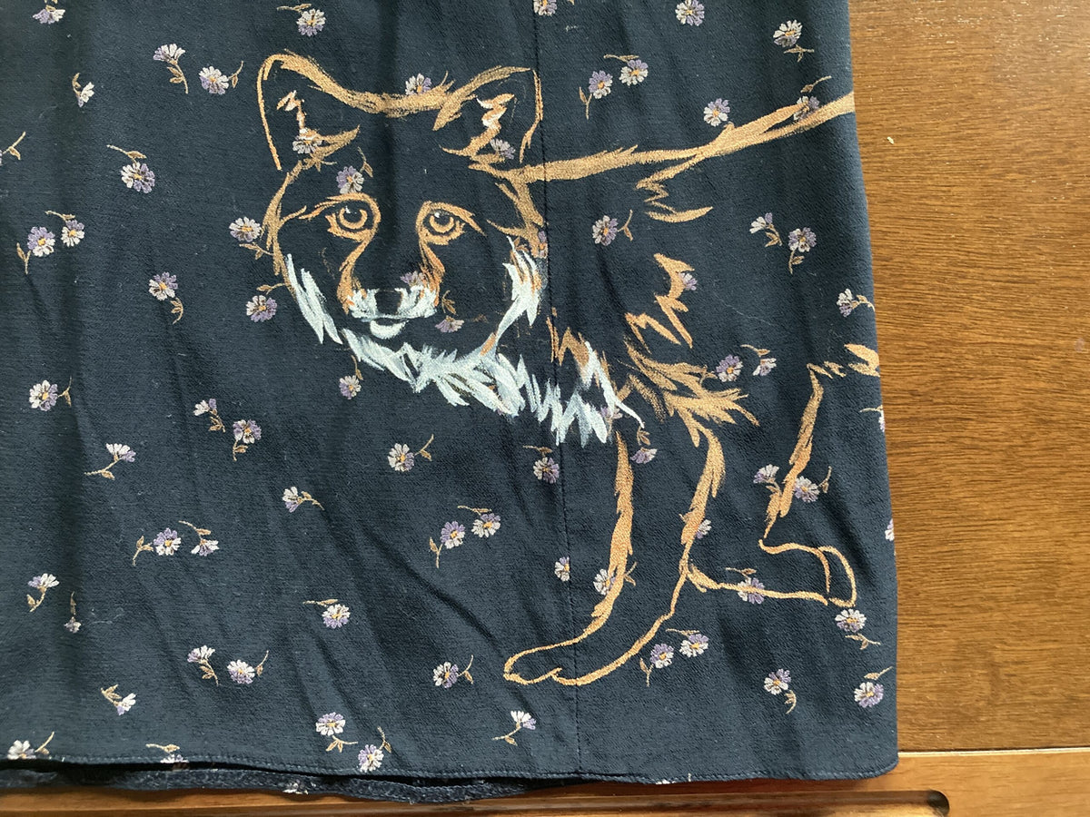 A Floral fox hand-painted vintage skirt with a dog and flowers on it.