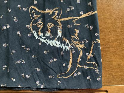 A Floral fox hand-painted vintage skirt with a dog and flowers on it.