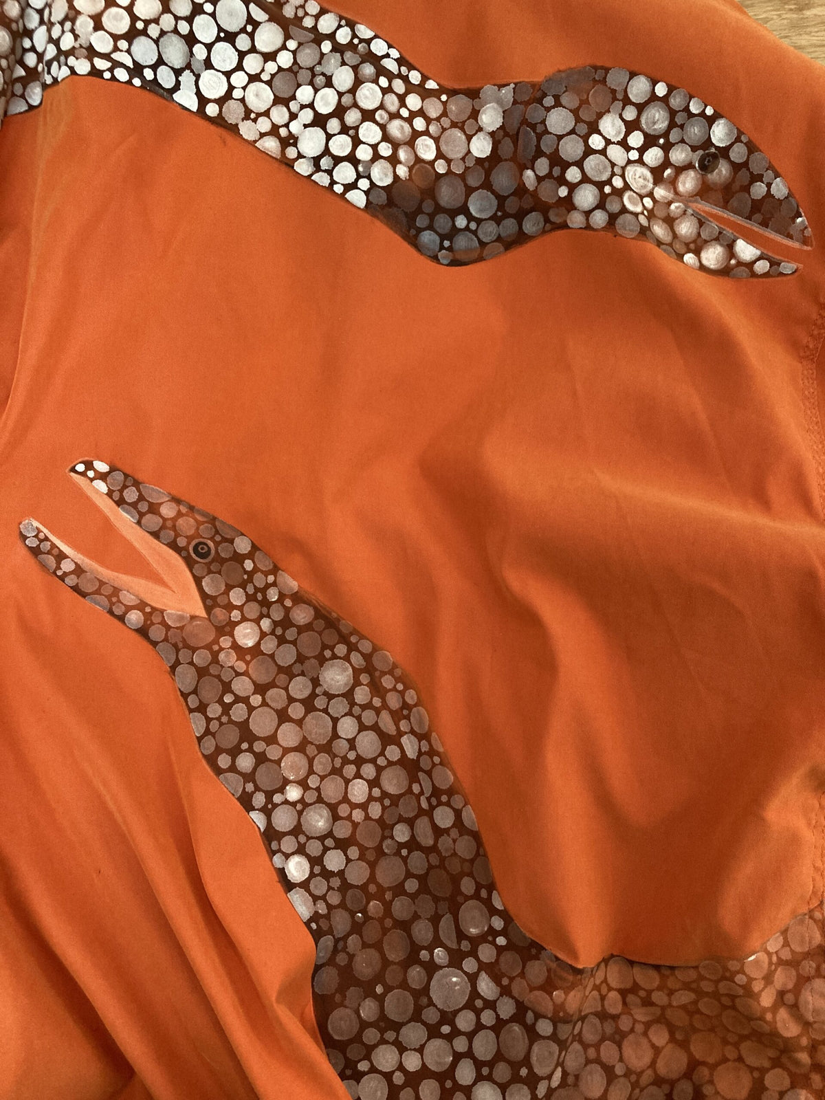 Orange jacket with hand-painted eels