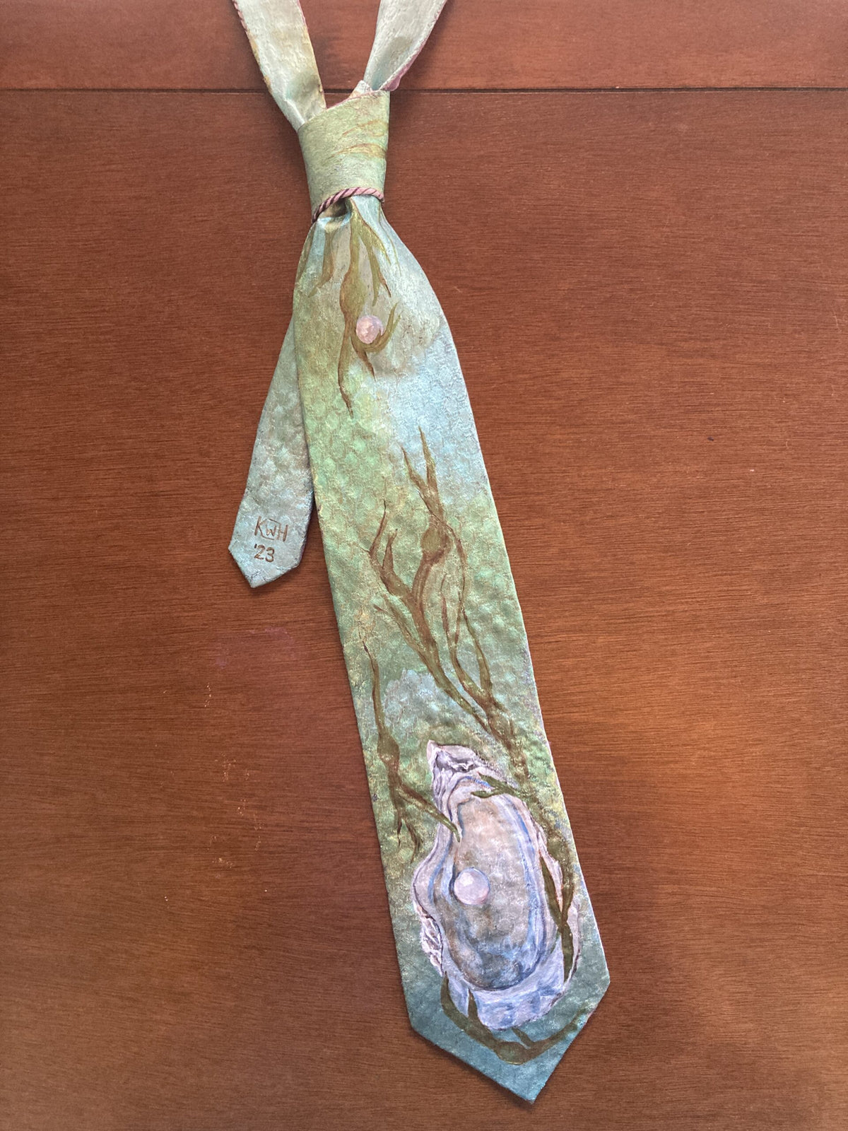 Hand-painted oyster and pearl ocean magic tie