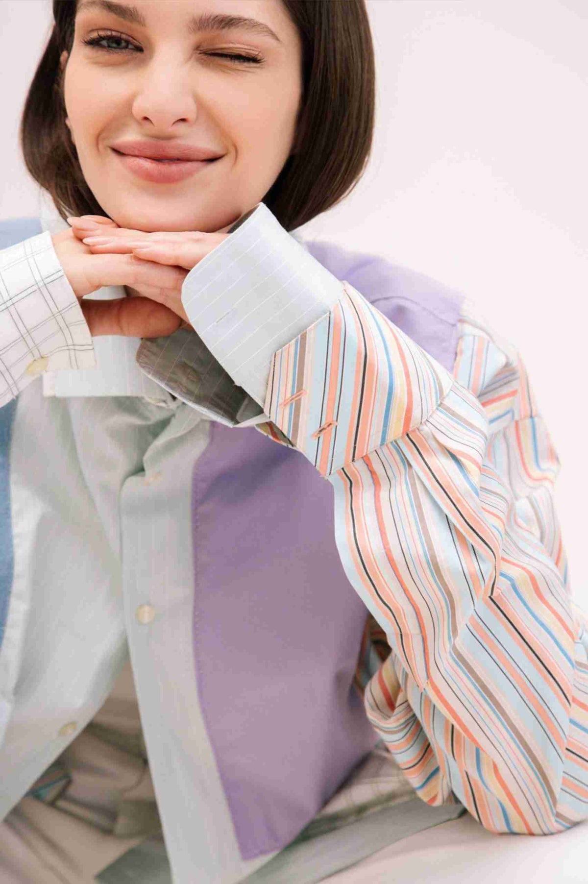 a woman sitting down with a knife in her hand.