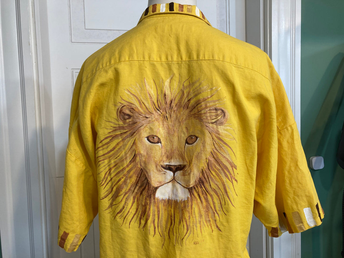 A yellow shirt with a lion on it.