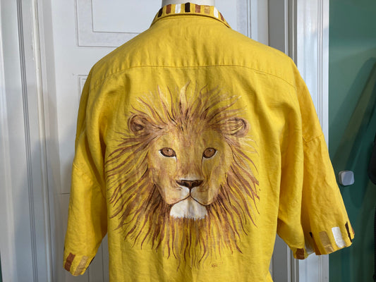 A yellow shirt with a lion on it.