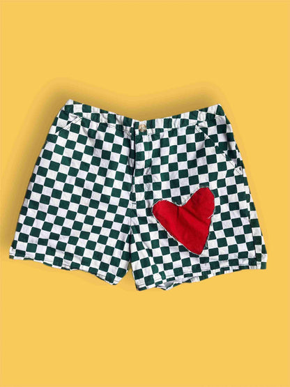 a black and white checkered shorts with a red heart.
