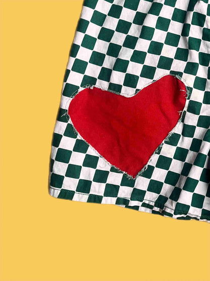 a piece of cloth with a red heart on it.