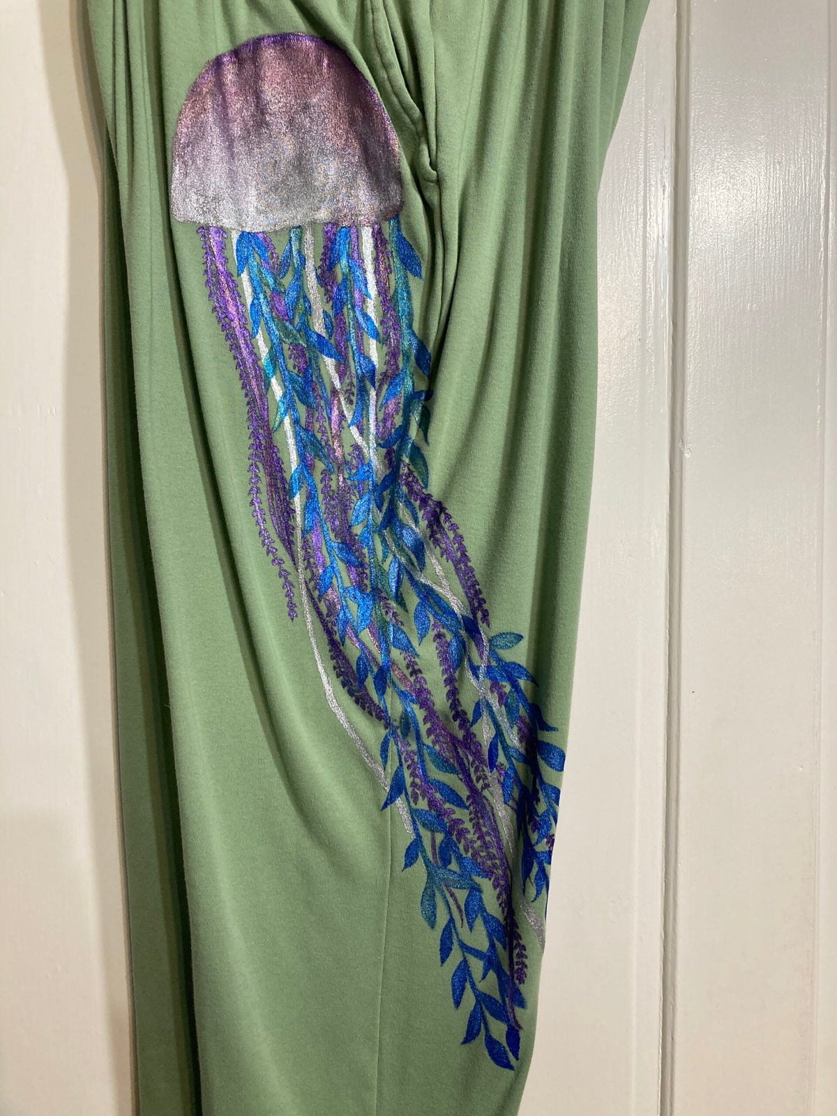 Green sweatpants with a jellyfish on it.
