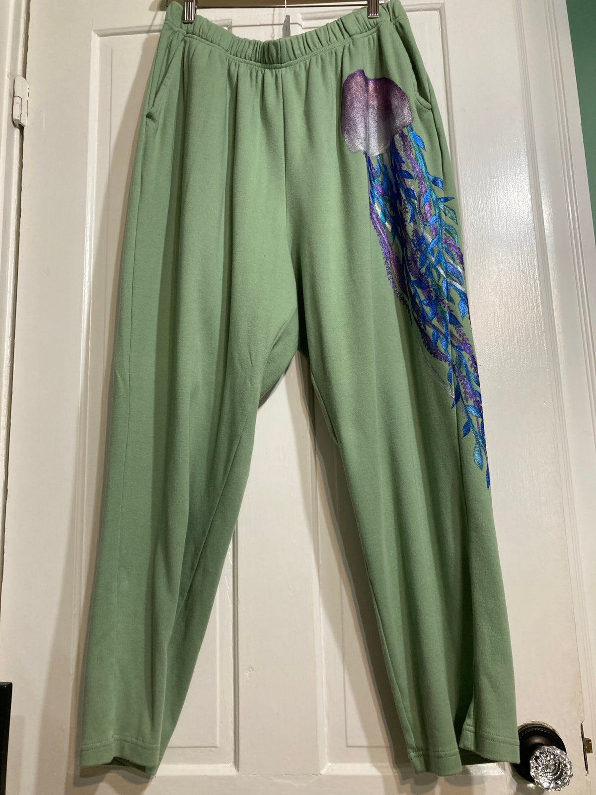 Green sweatpants with a jellyfish on it.