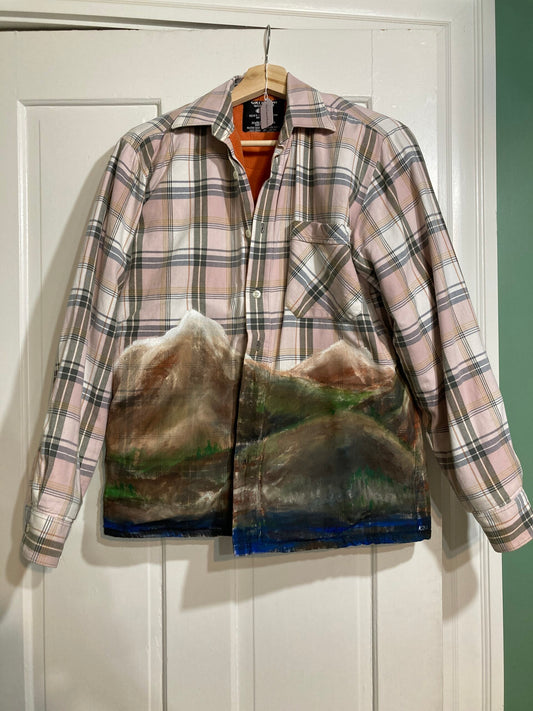 A plaid shirt with mountains on it.