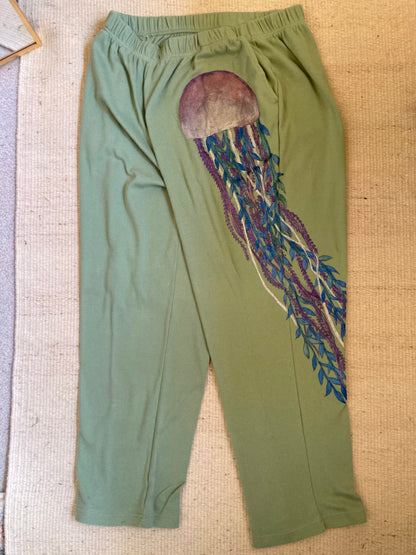 A pair of green pants with a jellyfish on them.