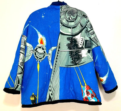 A blue jacket with a spaceship on it.