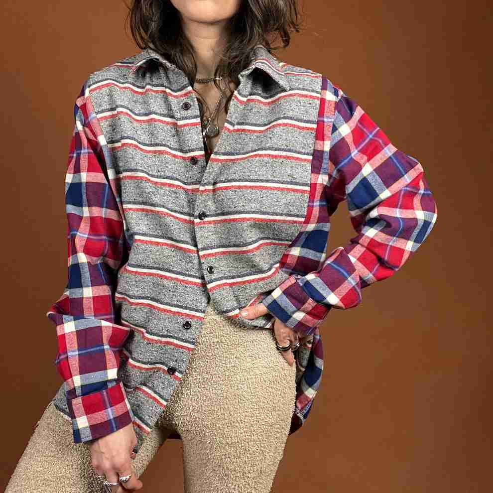 a woman in a plaid shirt poses for a picture.