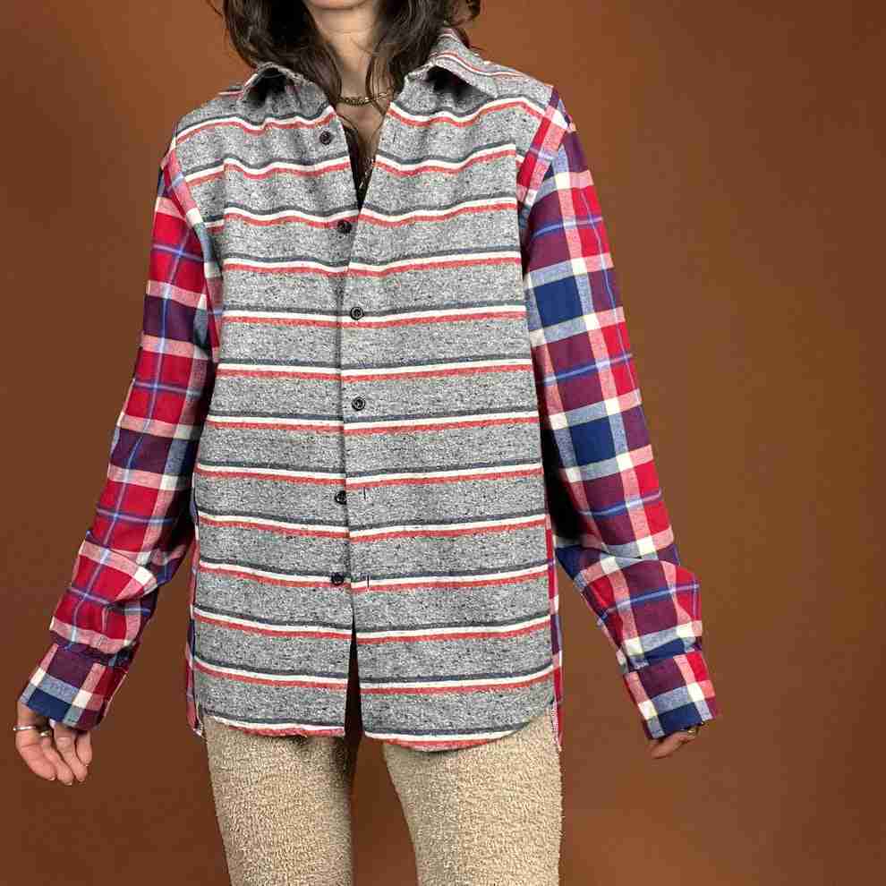 a woman wearing a plaid shirt and leggings.