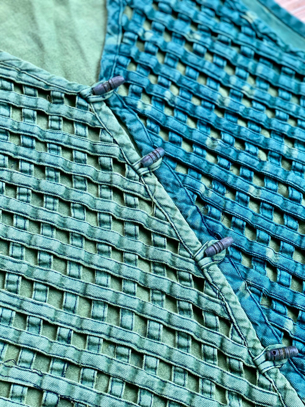 A close up of a blue woven fabric.