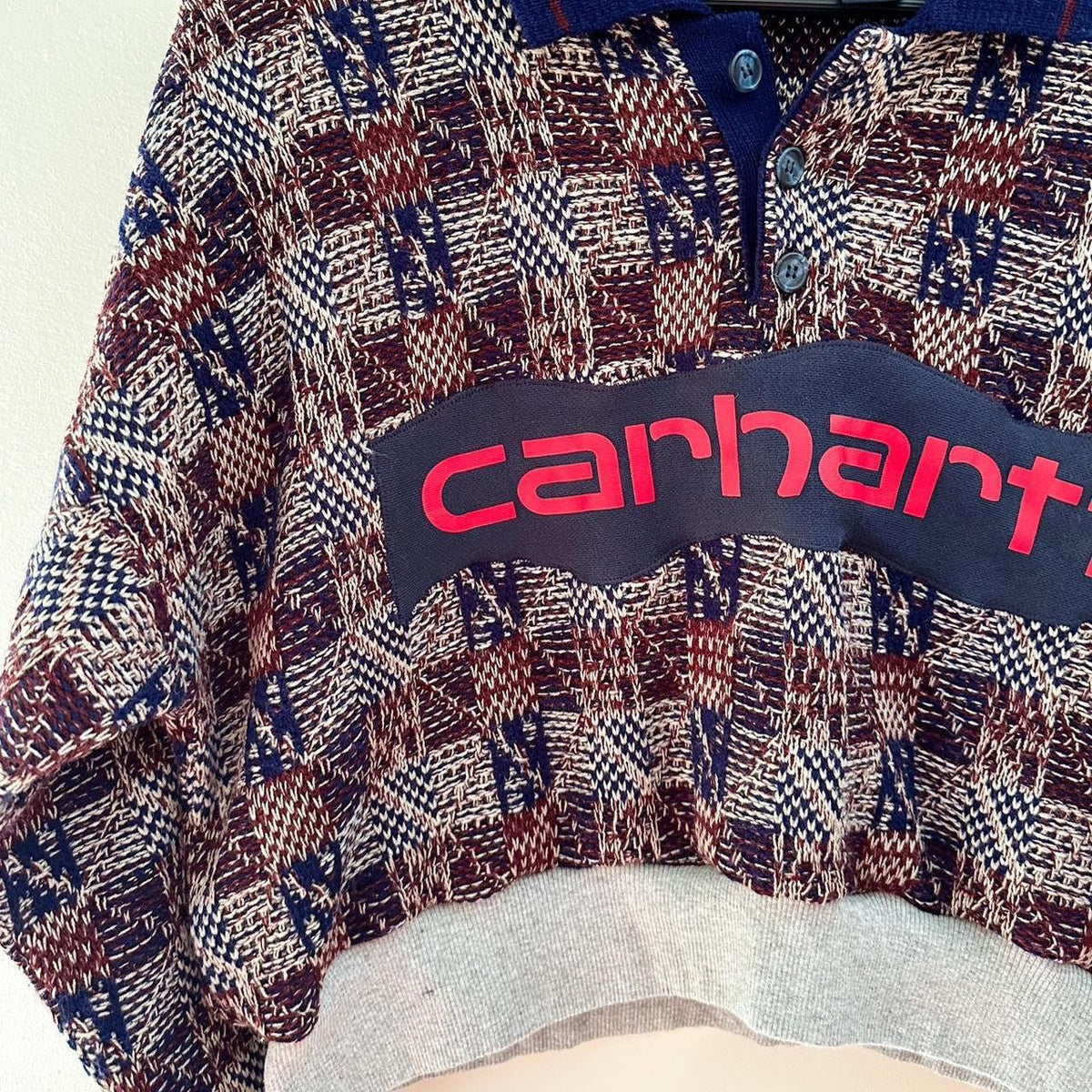 A sweater with the word carhartt on it.