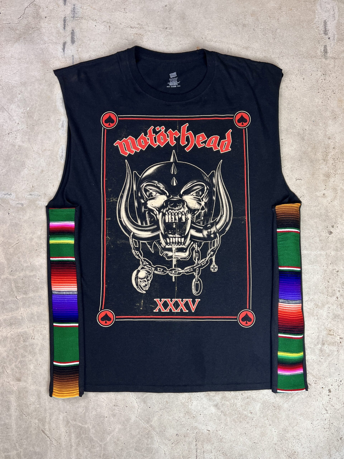 A black t - shirt with a skull and crossbones on it.