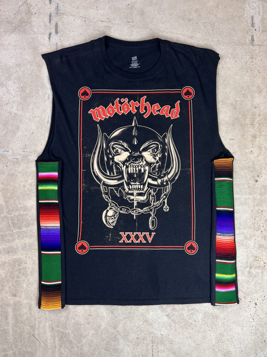 A black t - shirt with a skull and crossbones on it.