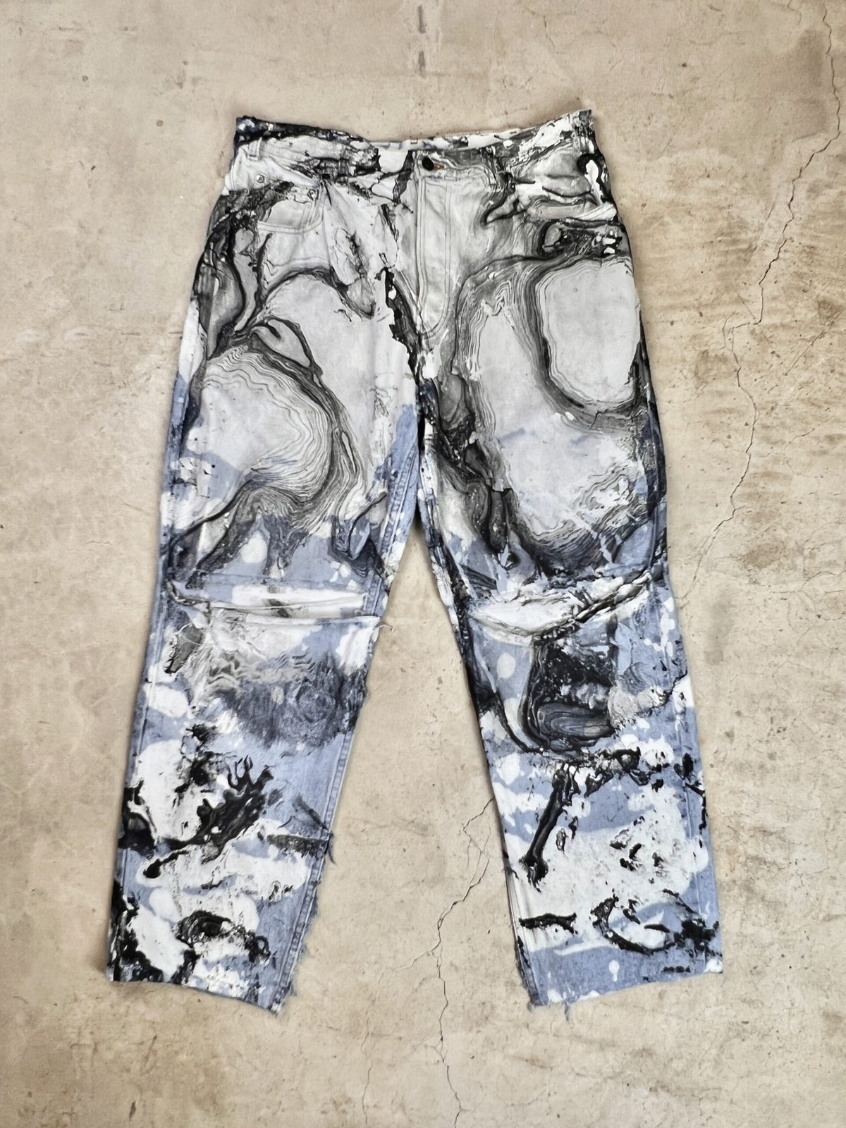 A pair of pants with a black and white pattern.
