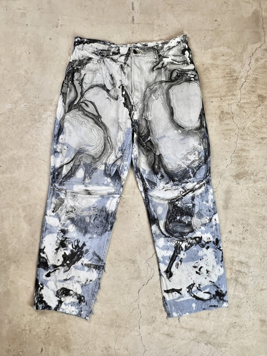 A pair of pants with a black and white pattern.