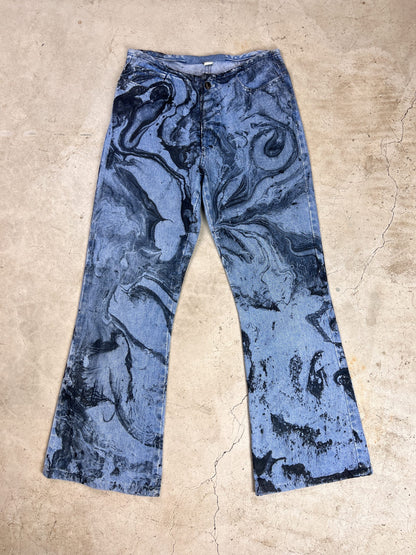A pair of blue jeans with a black and white print.