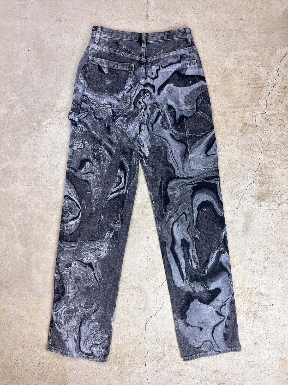 A pair of black and white marbled pants.