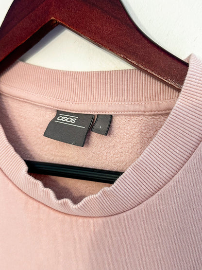 A pink shirt on a swinger.