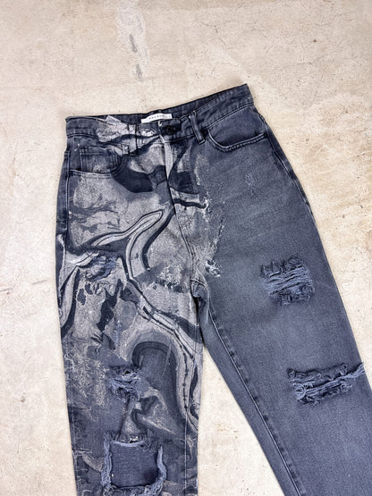 A pair of jeans with a black and grey pattern.