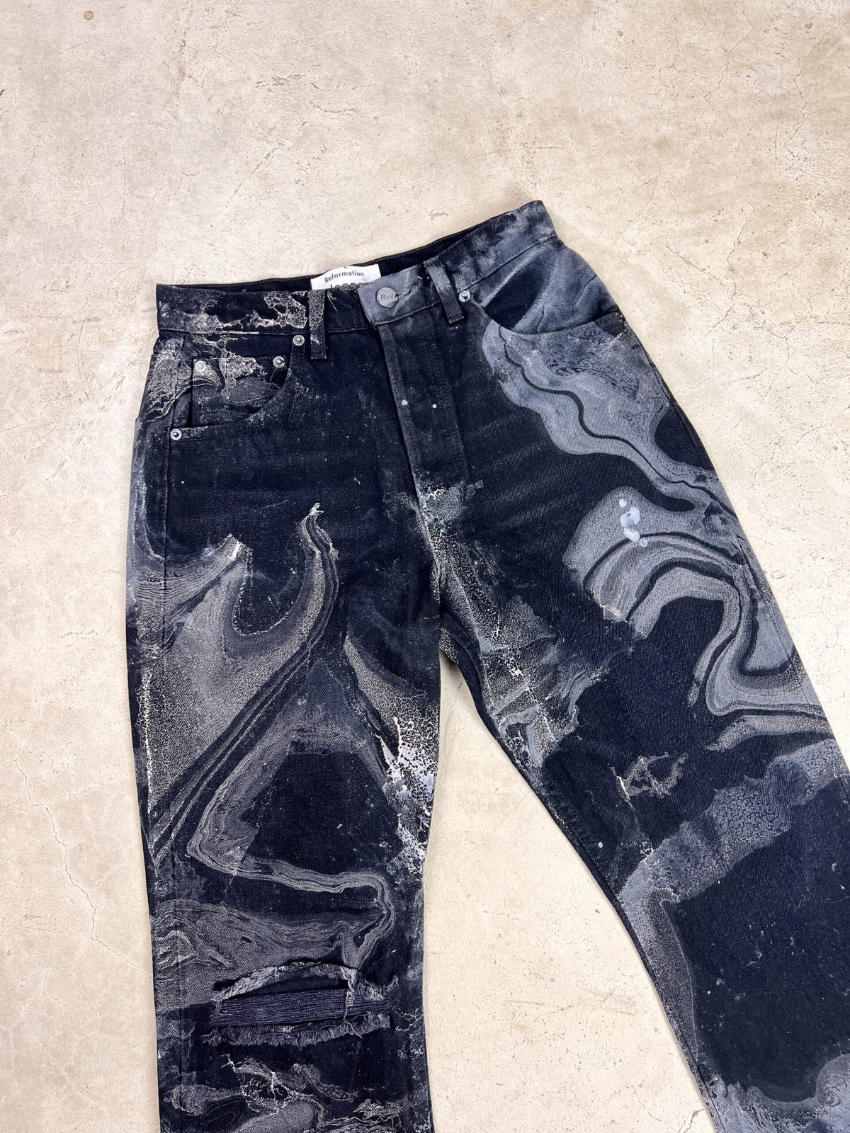 A pair of black and white jeans with a black and white pattern.