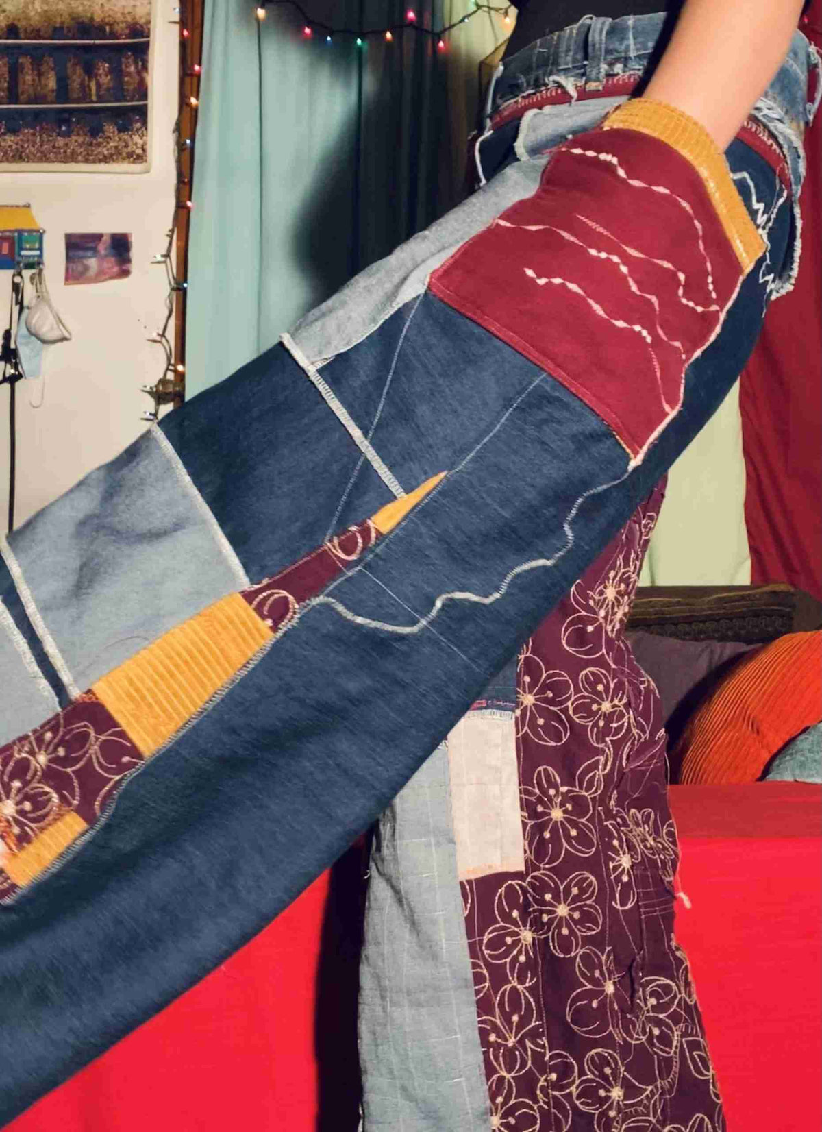 a woman is holding a piece of cloth in her hand.