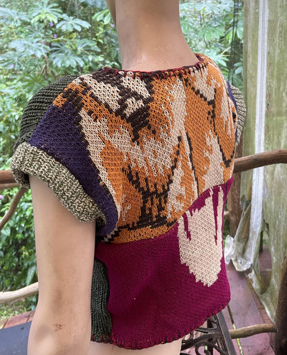 a mannequin wearing a colorful knitted sweater.