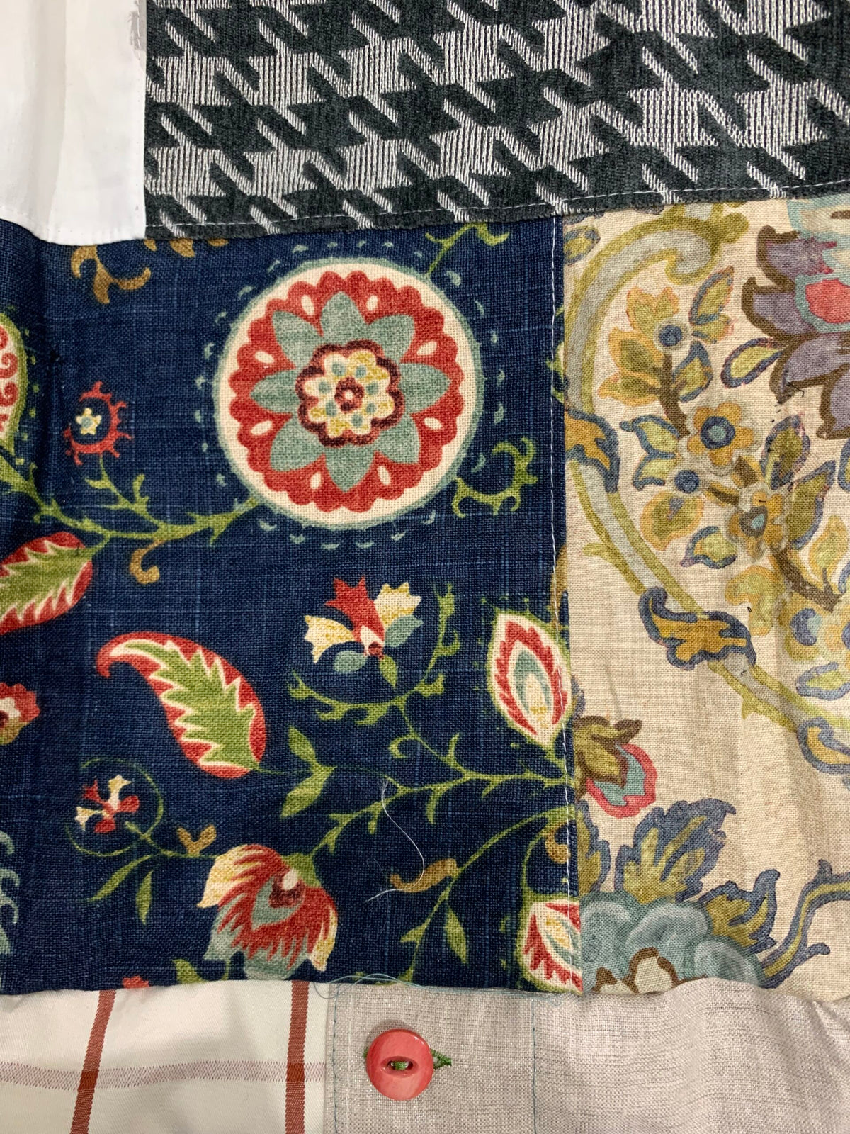 A patchwork quilt with floral designs.