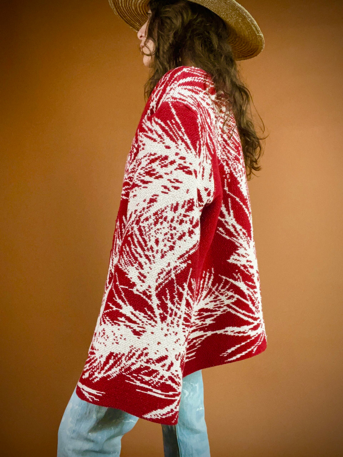 A woman wearing a red jacket and hat.
