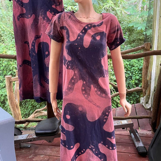a mannequin wearing a dress with an octopus print.