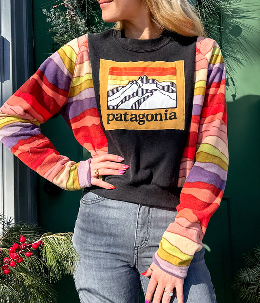 A woman wearing a colorful shirt.