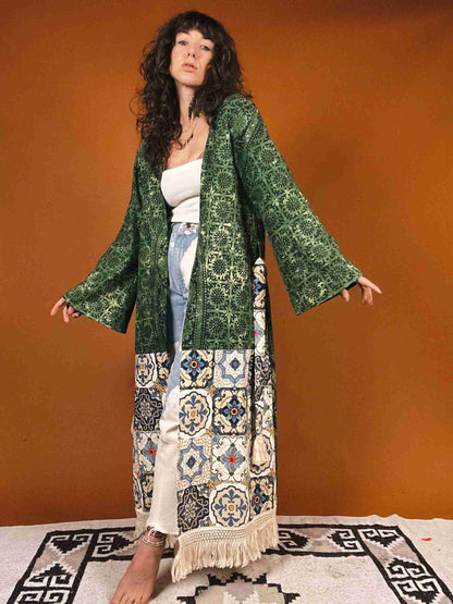 a woman standing on a rug wearing a green jacket.