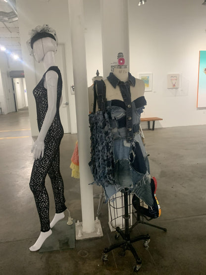 mannequins on display in an art gallery.