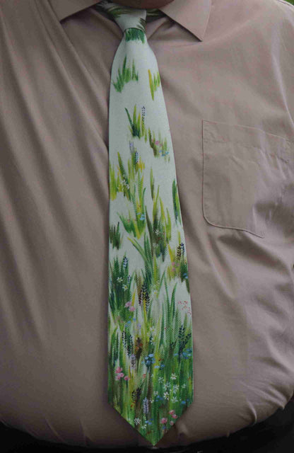 a man wearing a tie with a picture of flowers on it.