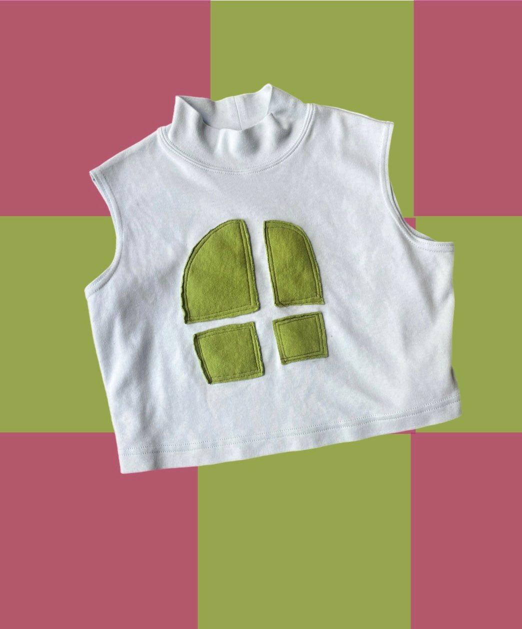 A white t - shirt with a green window on it.