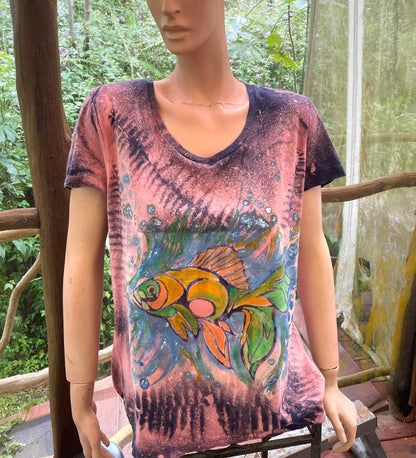 A mannequin wearing a t - shirt with a fish on it.