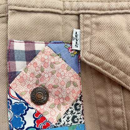 A close up of a pocket with a patch on it.