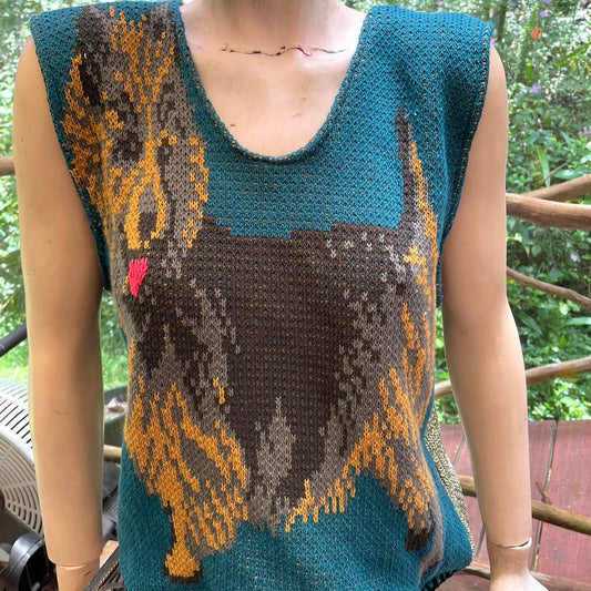 A woman wearing a sweater with a dog on it.